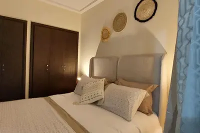a bed with pillows on it in a bedroom at New! Appartement les pieds dans l'eau WELCOME STAY in Pont Blondin