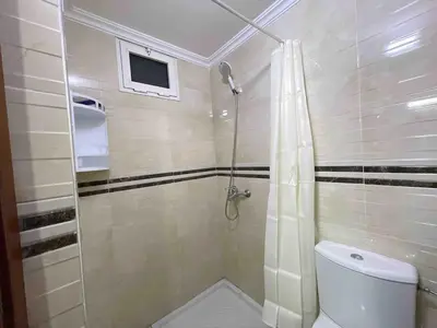 a bathroom with a shower and a toilet at Spacious & Comfy Moroccan Apartment in Temara