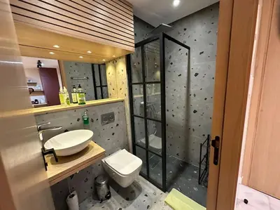 a bathroom with a toilet and a sink and a shower at Stylish Appartement Lumineux et Luxueux Au Coeur De Maarif Quartier Palmier Près De Station Tramway & Bd Abdelmoumen Casablanca in Casablanca