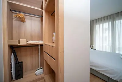 a bathroom with a tub and a bed and a window at Luxury Studio in Luxury Place in Casablanca