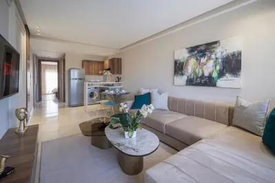 a living room with a couch and a table at Beautiful 1 Bedroom Appartment in Anfa in Casablanca
