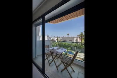 a view from the balcony of a house with a table and chairs at Beautiful 1 Bedroom Appartment in Anfa in Casablanca