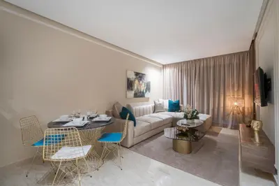 a living room with a couch and a table at Beautiful 1 Bedroom Appartment in Anfa in Casablanca