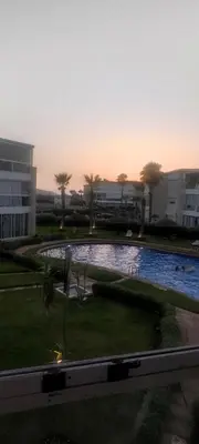 a courtyard with a swimming pool in a building at Les perles de Tamaris in Dar Mohammed Ould Haj Jilali