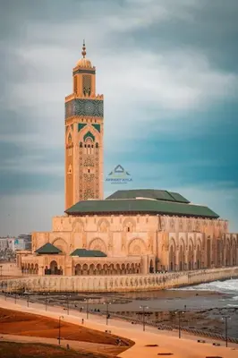 a large building with a clock tower on top of it at Royal Senior Suite 3Bd & 3Ba -By Appart Ayla in Casablanca-Port