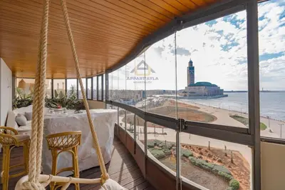 a room with a view of the beach and the ocean at Royal Senior Suite 3Bd & 3Ba -By Appart Ayla in Casablanca-Port