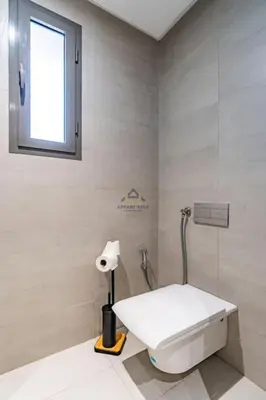 a bathroom with a white toilet and a window at Royal Senior Suite 3Bd & 3Ba -By Appart Ayla in Casablanca-Port