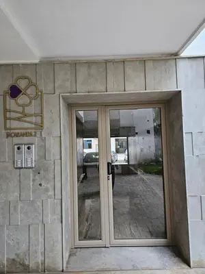 an entrance to a building with glass doors at MIA Appartement N2 - Élégance, Confort et Sérénité in Casablanca