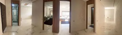 a row of mirrors in a room with marble floors at Bel appartement à louer sur bouznika de 117 m2 in Bouznika