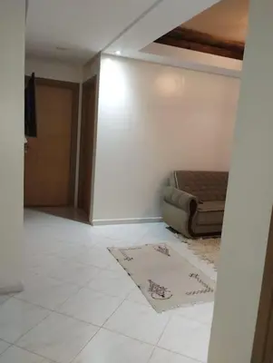a living room with a bed and a tiled floor at Appartement très propre lumineux en moyen standing a résidence klk darbouza in Casablanca