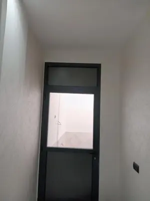 a door with a window in a room at L'ocean in Casablanca