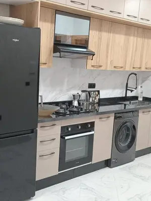 a kitchen with a stove and a sink and a dishwasher at L'ocean in Casablanca