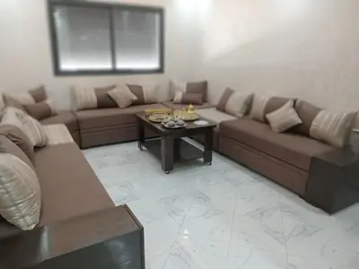 a living room with a couch and a coffee table at L'ocean in Casablanca
