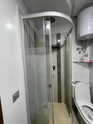 a shower stall in a bathroom with a toilet at residence rania in Maarif