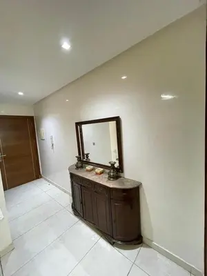 a bathroom with a vanity and a mirror on a wall at residence rania in Maarif