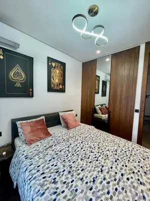 a bedroom with a large bed with two pillows at Vue imprenable sur Casa Finance City in Casablanca