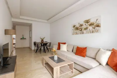 a living room with a couch and a table at Casa Gauthier - TT Holidays in Casablanca