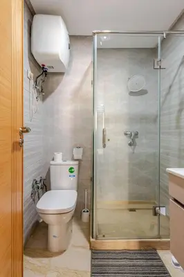 a bathroom with a toilet and a glass shower at Casa Gauthier - TT Holidays in Casablanca