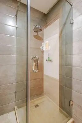 a shower with a glass door in a bathroom at Casa Gauthier - TT Holidays in Casablanca