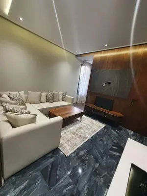 a living room with a white couch and a piano at Studio élégant in Casablanca