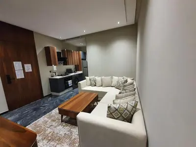 a living room with a white couch and a table at Studio élégant in Casablanca
