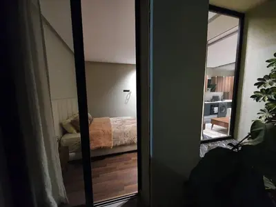 a mirror in a room with a bed in a bedroom at Studio élégant in Casablanca