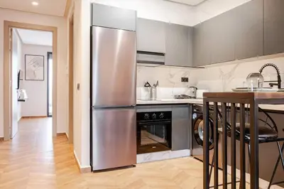 a kitchen with a stainless steel refrigerator at Emerald 32 Bourgogne Studio in Casablanca