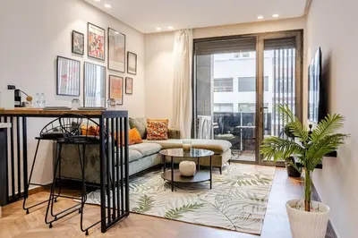 a living room with a couch and a table at Emerald 32 Bourgogne Studio in Casablanca