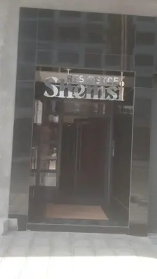 a store front with a sign in the window at Emerald 32 Bourgogne Studio in Casablanca
