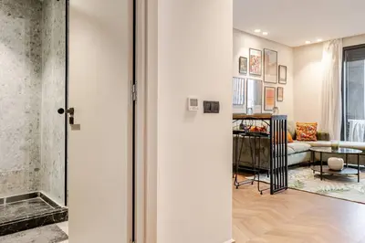 a hallway with a living room with a couch at Emerald 32 Bourgogne Studio in Casablanca