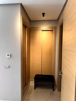 a hallway with a bench in front of a door at Skyline Albert Luxury 2 a proximité de la gare Casa voyageurs Casablanca in Casablanca