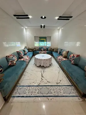 a living room with a couch and a table at Appartement corniche d'or, Mohammedia in Mohammedia