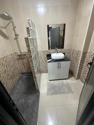 a bathroom with a sink and a mirror at Appartement corniche d'or, Mohammedia in Mohammedia