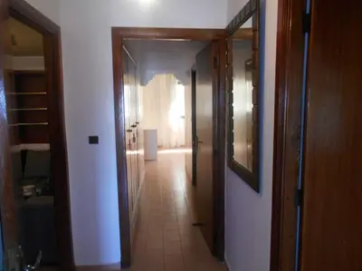a hallway with a hallway leading into a room at Spacious apartment in Rabat Agdal 1937,5 ft2 - 180m2 in Rabat
