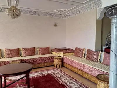 a living room with a couch and a table at Spacious apartment in Rabat Agdal 1937,5 ft2 - 180m2 in Rabat