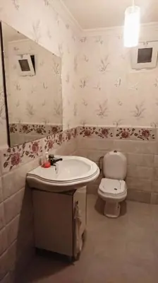 a bathroom with a sink and a toilet at Spacious apartment in Rabat Agdal 1937,5 ft2 - 180m2 in Rabat