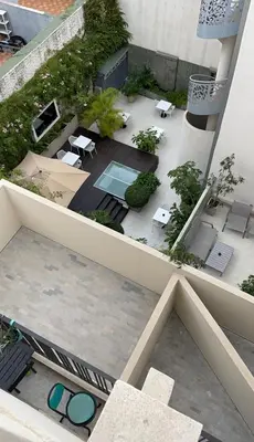 an overhead view of a courtyard with a pool on a building at Golden Spot Casablanca in Casablanca