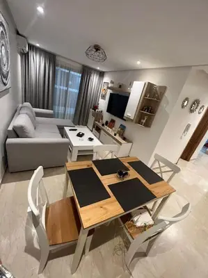 a living room with a table and a couch at Perfect Studio in Casablanca City Center in Casablanca