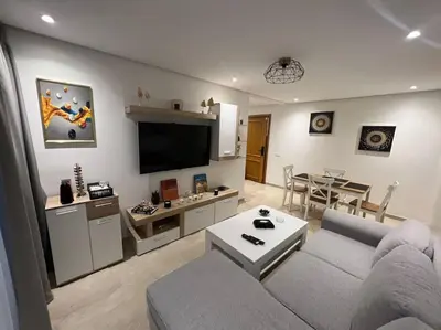 a living room with a couch and a table at Perfect Studio in Casablanca City Center in Casablanca