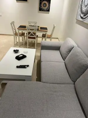 a living room with a couch and a table at Perfect Studio in Casablanca City Center in Casablanca