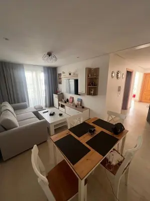 a living room with a table and a couch at Perfect Studio in Casablanca City Center in Casablanca