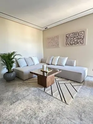 a living room with a couch and a table at Studio Monaco in Casablanca
