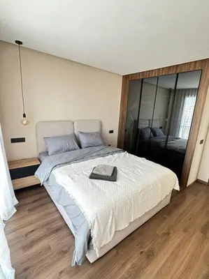 a bedroom with a large bed with a tray on it at Studio Monaco in Casablanca