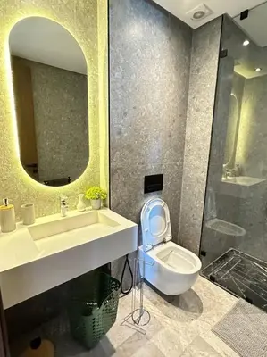 a bathroom with a sink and a toilet and a mirror at Studio Monaco in Casablanca