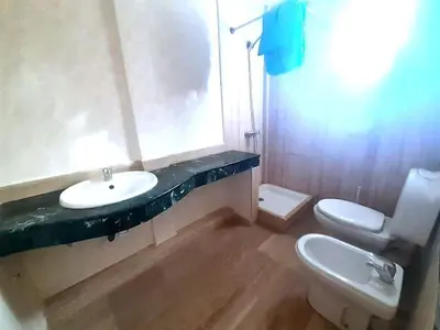 a bathroom with a sink and a toilet at Lux Appartement maarif in Casablanca
