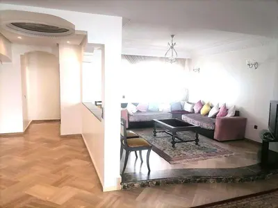 a living room with a couch and a table at Lux Appartement maarif in Casablanca