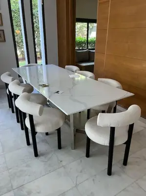 a white table and chairs in a room at Luxurious Golf Villa with Pool in Bouskoura