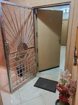 a door to a room with a dog inside at Ricoflores palm benslimane in O Ben Slimane