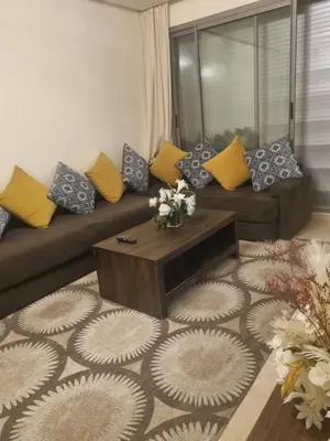 a living room with a couch and a coffee table at Downtown Stay 1Br near Tramway - Parking in Casablanca