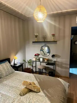 a bedroom with a bed with a hat on it at Sea view apartment in Casablanca